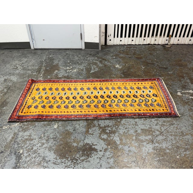 Design Plus Gallery presents a 3ft1in × 9ft4in Vintage Hand Knotted Wool Runner. This vintage hand-knotted wool runner...