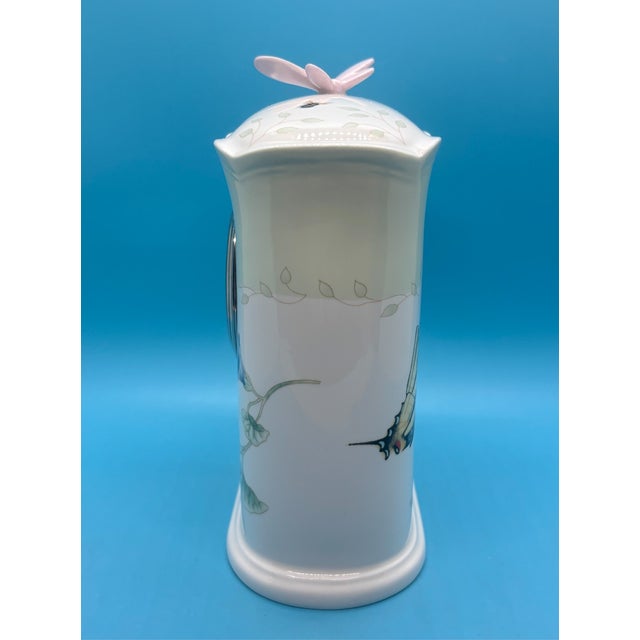 Bring the beauty of an English garden into your home with this elegant Lenox Butterfly Meadow Desk Clock, featuring the...