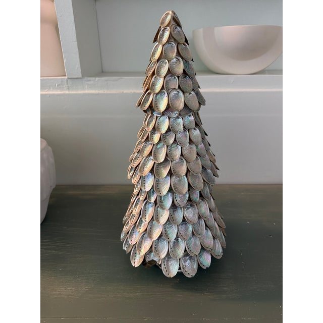 Striking handcrafted decorative tree sculpture composed of individually layered natural abalone shells. Standing an...