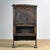 This Spanish oak cabinet from circa 1800 is an antique piece of furniture with character. Crafted from solid oak, it...