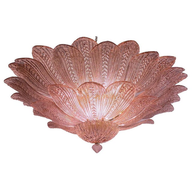 Realized in pure pink amethyst color Murano glass consists of 45 delicious hand-blown leaves. The structure is gilt-metal....