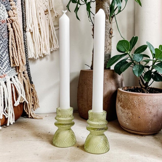 Elevate your home decor with these Transparent Green Ribbed Glass Taper Candle Holders, designed to add a touch of...