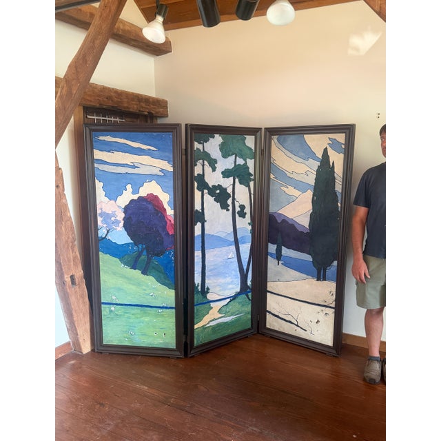 Three original paintings inset in a high quality wood frame and presented as a room divider. Paint is showing age and...