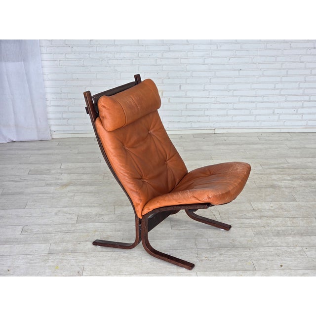 1970s, Norwegian design by Ingmar Relling. Lounge chair, model "Siesta". Original brown furniture leather, canvas, bent...