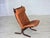 1970s, Norwegian design by Ingmar Relling. Lounge chair, model "Siesta". Original brown furniture leather, canvas, bent...