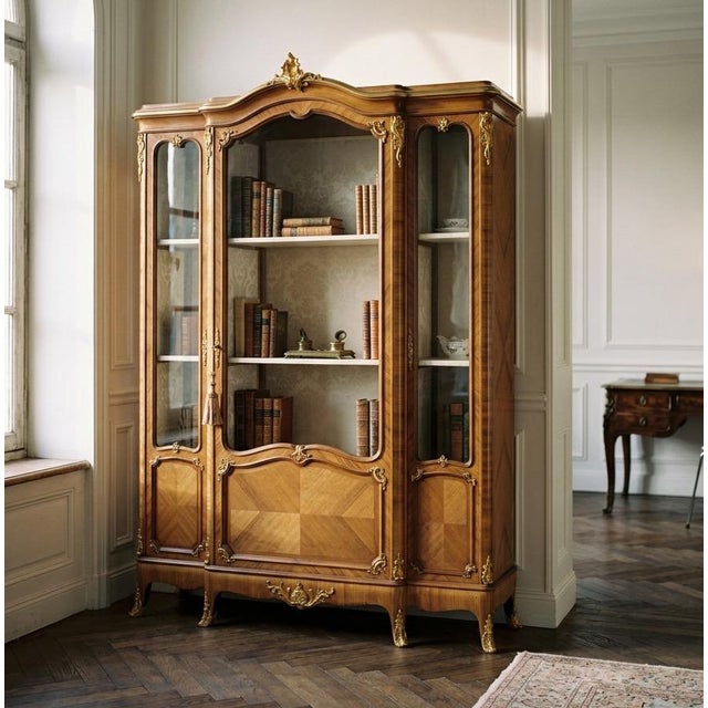 A fine antique French Louis XV style bibliotheque (bookcase), or display cabinet made by master ébéniste Schmit & Cie....