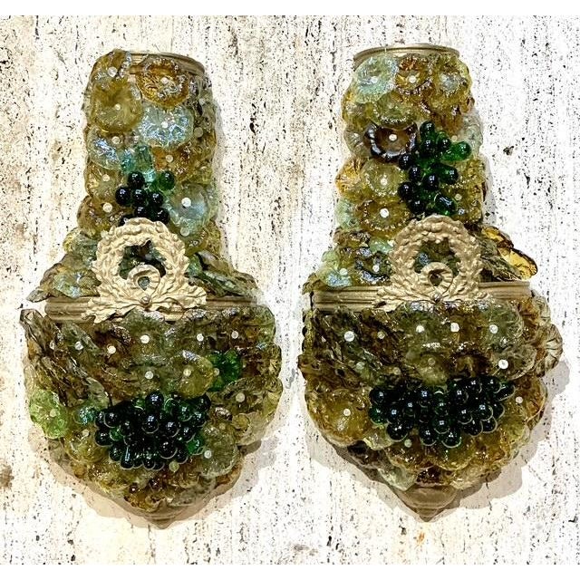 Elevate your interior with this exquisite pair of vintage Italian Murano glass sconces, a masterful example of mid-century...