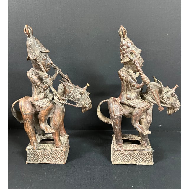 ITEM NAME: African Tribal Art Pair of Benin Bronze Warrior Figures on Horseback ORIGIN: Benin Africa AGES: Late 20th...