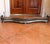 A fine serpentine shaped fender with a brass latticework grille set between mouldings of polished steel, and resting on...
