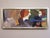 THE RUMOUR Oil on board Size: 15.7 x 36 inches (including frame) An expressive figurative composition depicting a...