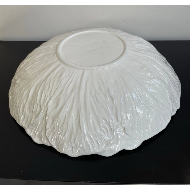 Bring classic farmhouse charm to your table with this beautiful vintage California Pottery cabbage leaf serving bowl....