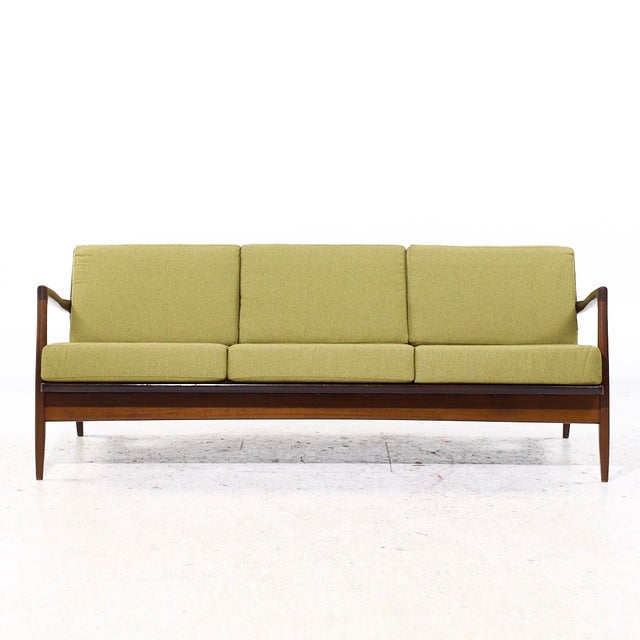 Kofod Larsen for Selig Mid Century Danish Walnut Sofa This sofa measures: 74 wide x 32 deep x 27 inches high, with a seat...