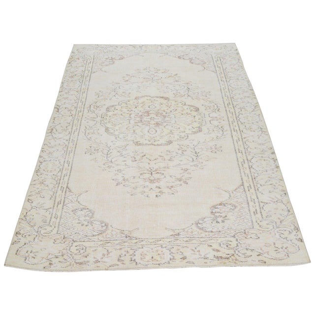 Vintage Turkish Anatolian Hand Knotted Wool Rug with natural colors and medallion style.