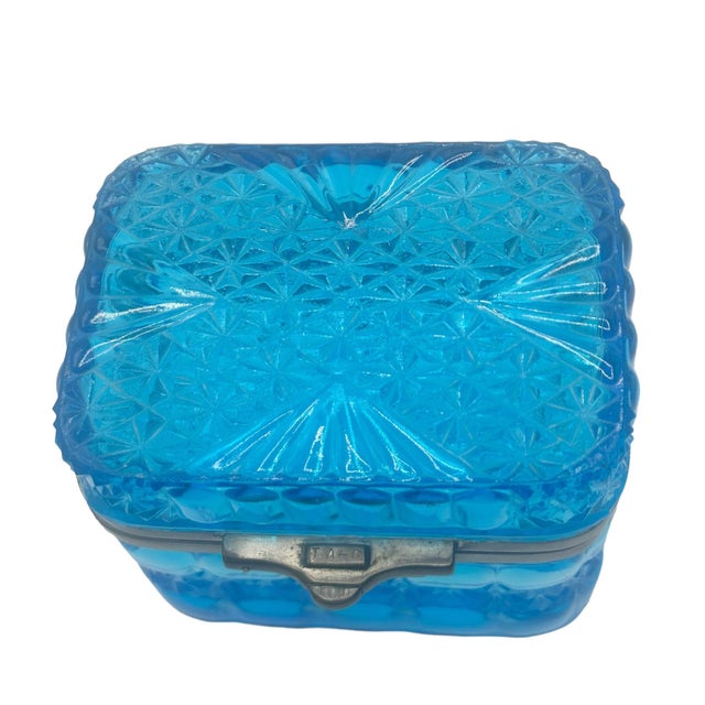 This beautiful blue pressed glass box is from the late 1800s. Czechoslovakia pressed glass items from this time were...