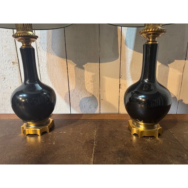 A high quality pair of French Table Lamps. Retaining their original retail label 'Porcelaine De Paris'. Made from solid...