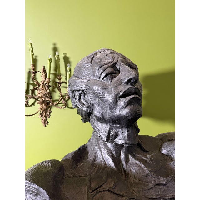 A magnificent sculpture by renowned artist Cindy Jackson depicting a stylized nude male figure. Cast in a resin/ composite...