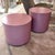 A wonderful pair of mauve colored rolling drum laminate side tables. One is 2" taller than the other, both have the same...