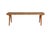 A primitive solid wood bench, rich with patina, grain and fissures in the wood. Carved with four slightly splayed legs. We...