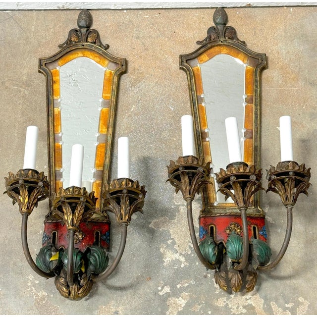 Pair Venetian Eglomise Mirror and Polychromed 3 Light Wall Sconces, Circa 1925 This exquisite pair of Venetian-style wall...