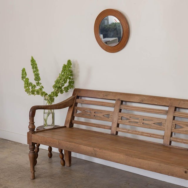 Lovely provincial oak bench from France, 1920s. Timeless design with beautiful detail on back with carved arms and legs....