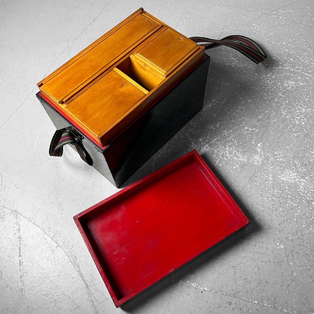 Traditional Japanese lacquer storage box with compartments and carrying strap. Dimensions: height 22 cm, width 31.5 cm,...