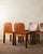 A vintage set of four italian dining chairs in warm-toned curved plywood and wood, attributed to molteni and produced in...
