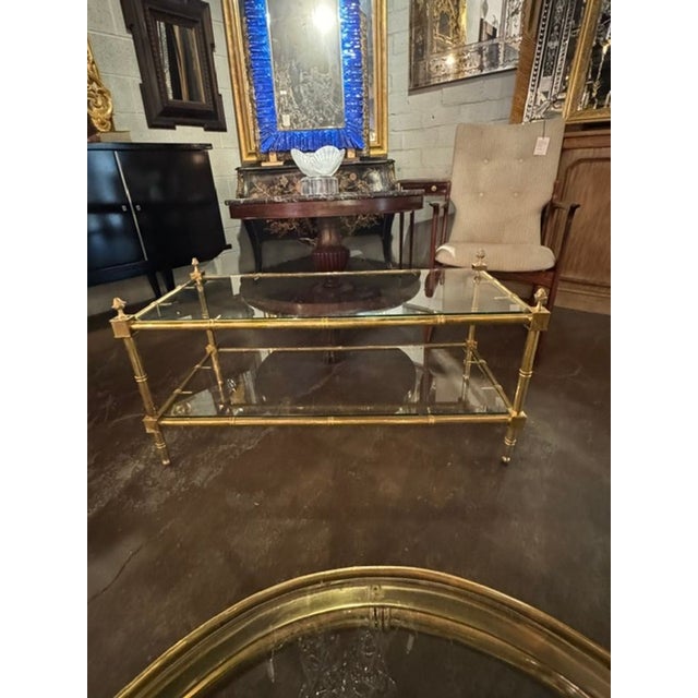 The Italian Brass Coffee Table is a luxurious and elegant piece of furniture. Made with a gorgeous brass base and glass...