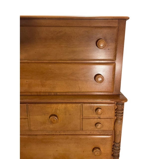 Stunning tall Virginia House five drawer dresser made with Maple wood. Carved turned detail on each side of the dresser.