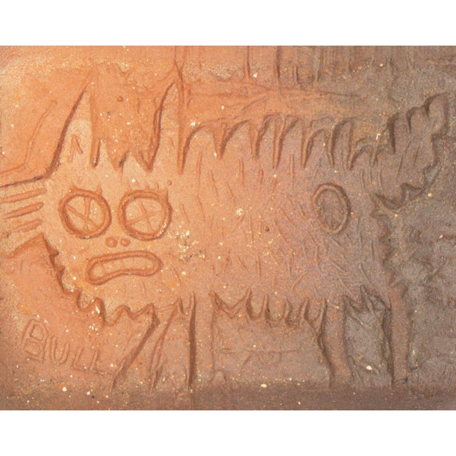 A studio pottery tile by the American artist Mark Bulwinkle (born 1946). This rectangular tile features the impressed...
