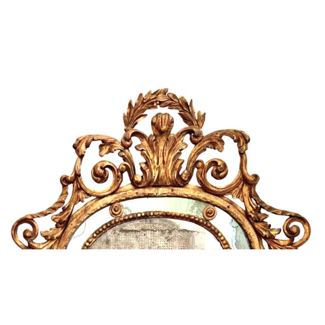 What a stunning piece! The 18th century Paraclose Piemonte Mirror is a masterpiece of decorative art. Here's a breakdown...