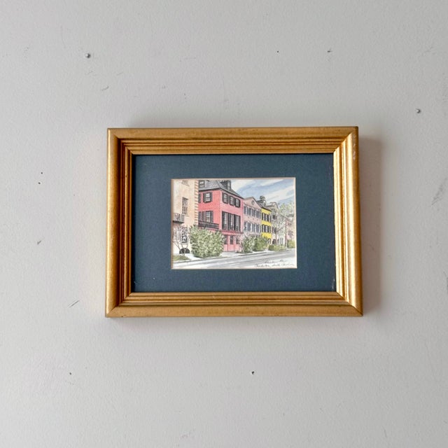 Vintage framed and matted Charleston, South Carolina Rainbow Row print. The print is titled, yet unsigned.
