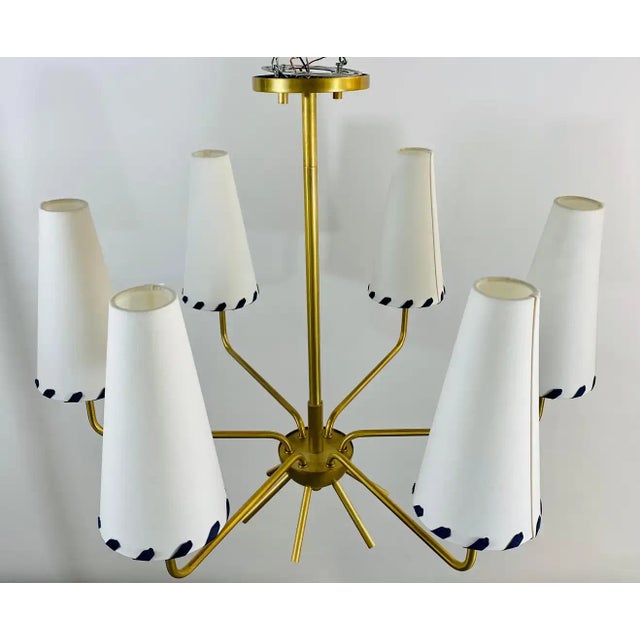 An elegant Mid-Century Modern sputnik gilded chandelier. Featuring a sleek design, the chandelier is embellished with...