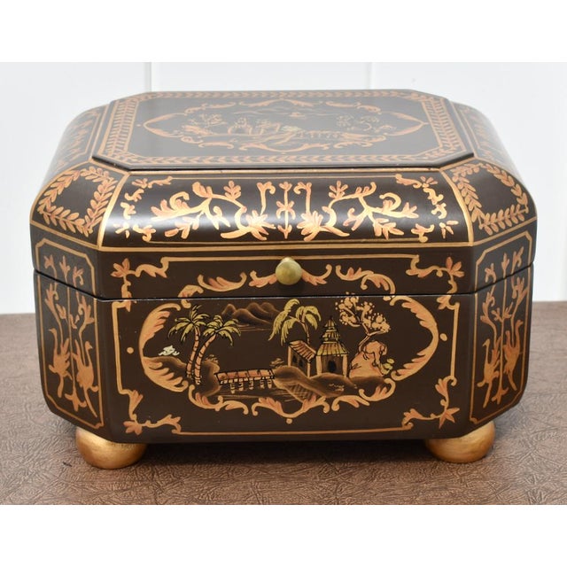 Vintage (1980's) Flip Top Chinoiserie Box. Made of Wood. The Decorative Box has a Brown & Gold Painted Finish. Is Felt...