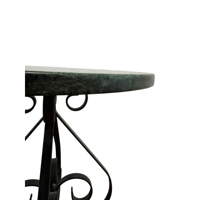 This one checks every box. A lush round top in deep Verde Alpi marble — forest green with dramatic white veining, polished...