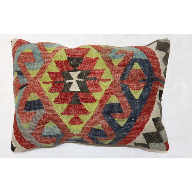 A pillow from a Turkish 20th century Kilim 15'' x 24'' . zipper closure and poly fill insert provided