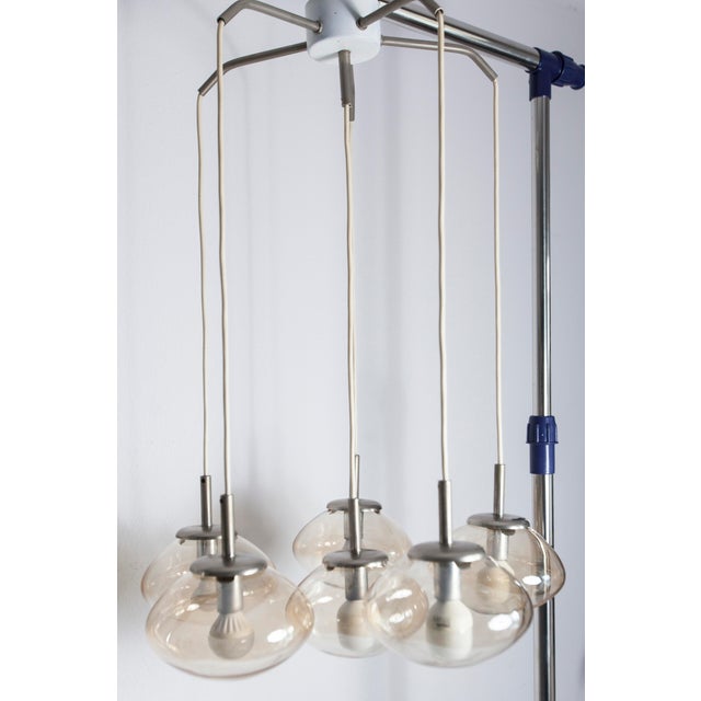1960s vintage chandelier with six light smoked glass drops. The drops are in very good condition, and the entire piece is...