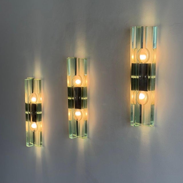 An extraordinary and rare set of three wall sconces attributed to Paolo Piva for Gallotti & Radice, Italy, circa 1970s,...