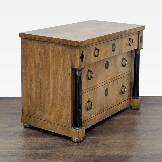 This Baker Furniture dresser features a classic wood finish and three spacious drawers with round brass pulls. The sturdy...