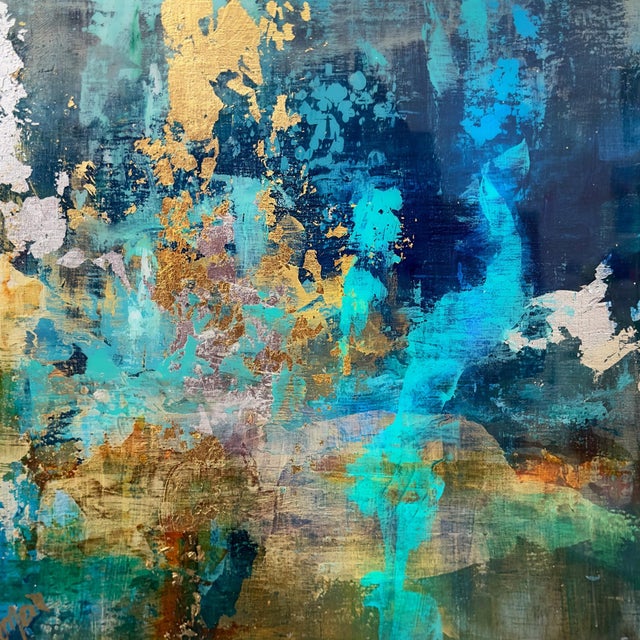 Deep Dive 1 immerses the viewer in a vibrant underwater world, where dynamic blues and shimmering golds intertwine to...