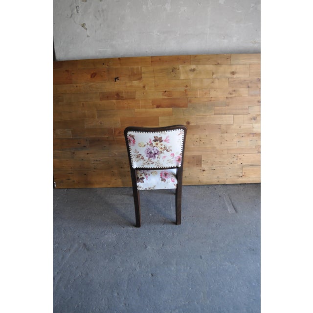 - Set of three Art Deco dining chairs - Stained and lacked frame and flower velvet upholstery - The chairs were completely...