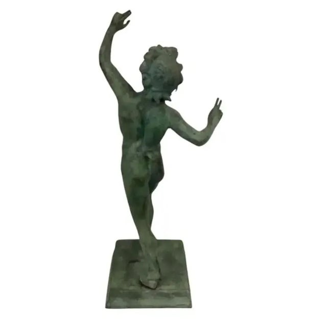 Italian classical bronze sculpture of the Dancing Faun of Pompeii. Fauns were an example of spirits of untamed woodland,...