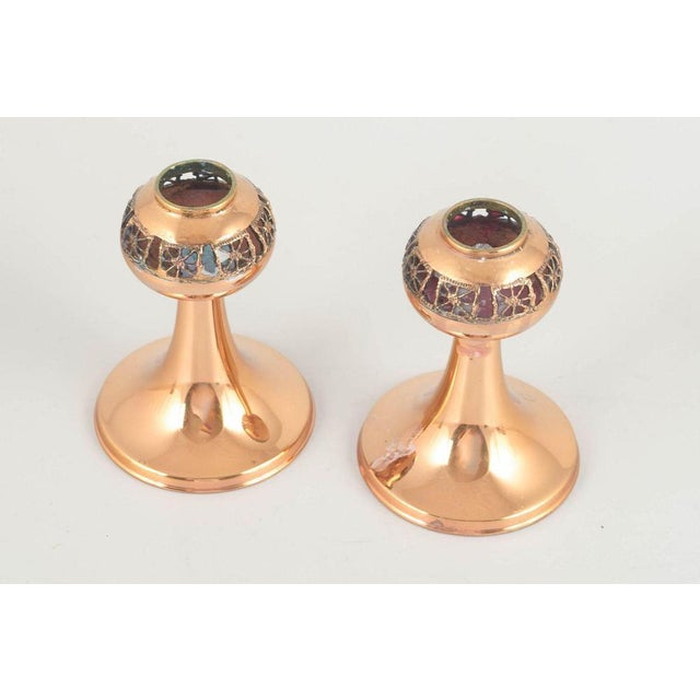 Pentti Sarpaneva Pair of candlesticks, 1960s. Elegant pair of brass candlesticks with decorative enamel in dark green and...