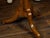 An Austrian Biedermeier period walnut guéridon table from the 19th century with radiating veneer and banding. Created in...