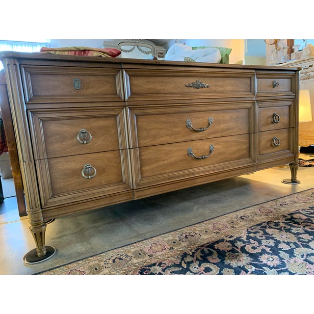 Here we have a fabulous vintage Henredon French Regency style dresser. This lowboy dates to the 1960's and has nine...
