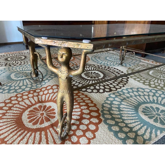 The androgynous figural cast iron Gueridon coffee table after Alberto Giacometti is a stunning piece of mid-century modern...