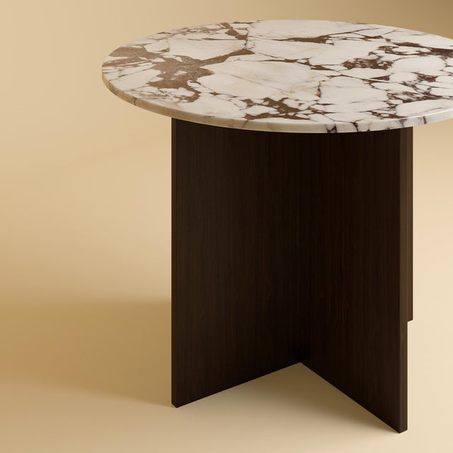 The Dalma is a Calacatta Viola marble and oak dining table, a table scaled for a room and its company. Stone and timber...