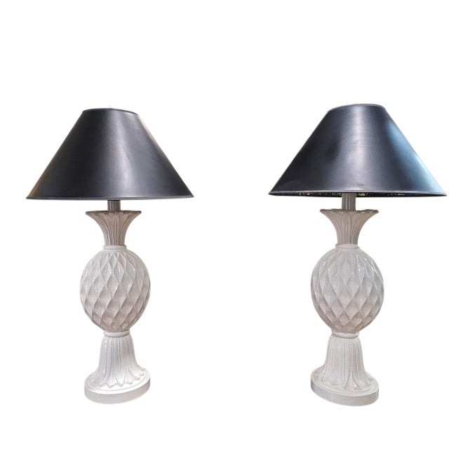 Add a touch of California coastal elegance to your interior with this charming pair of white ceramic pineapple table lamps...