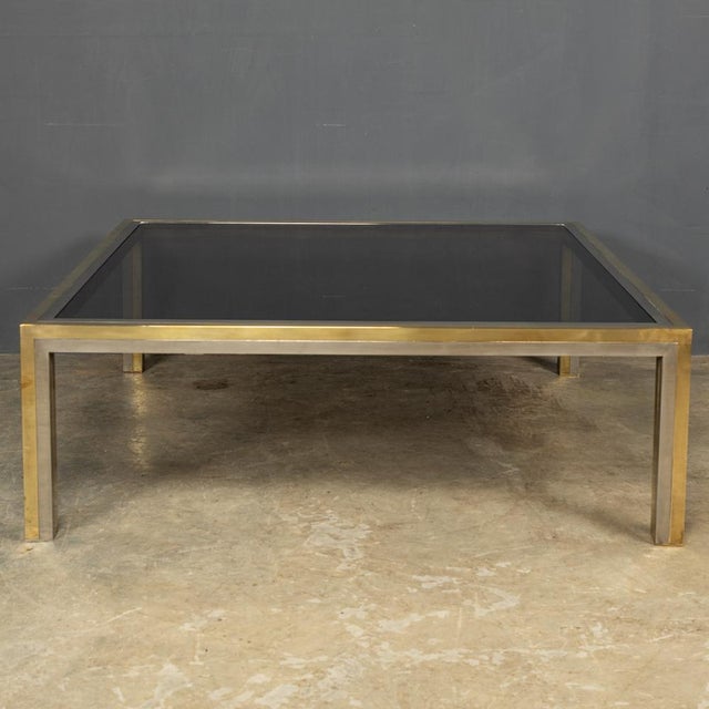 Striking 20th Century Italian made large brass and chrome square coffee table, with its original smoked glass​ top, in the...