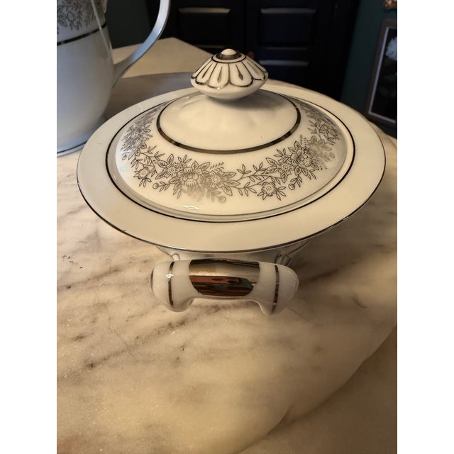 This vintage Seyei Fine China Japan Tea Set "Brilliant" #3208 from the 1970s is a rare find for collectors. The round,...