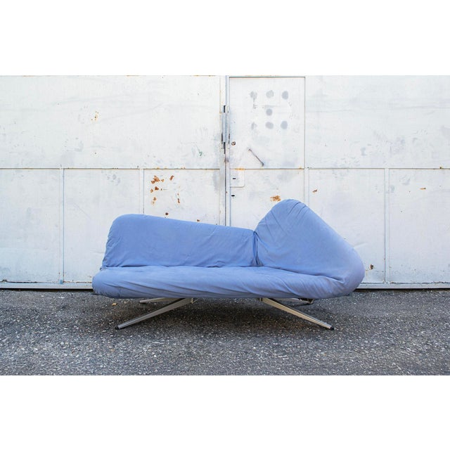 Three-seater sofa bed with fabric-covered padding and aluminum legs. Model Ribalta Designer Fabrizio Ballardini and Fulvio...